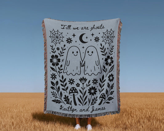 Charming blue woven blanket with cute ghost couple