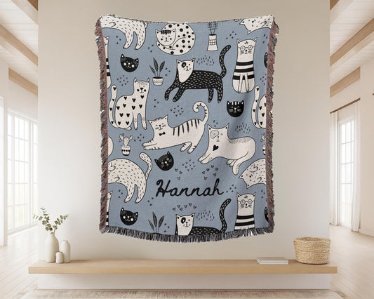 Personalized Black and White Cat woven blanket with Blue design for Pet on display